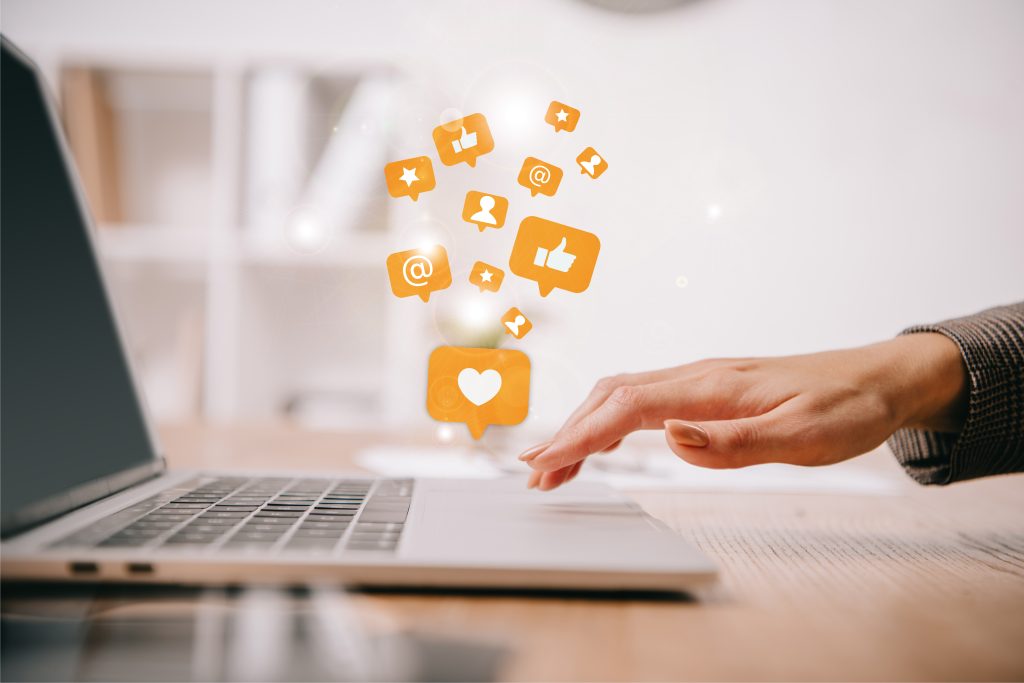 Social Media Icons coming out of a computer